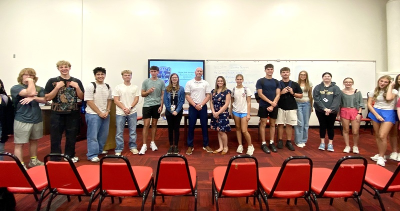 Photo of students with guest speaker