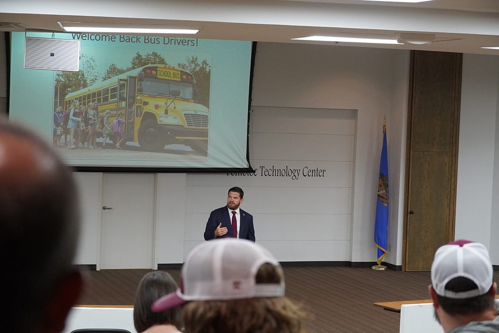 Travis Graham addressing attendees in the seminar center
