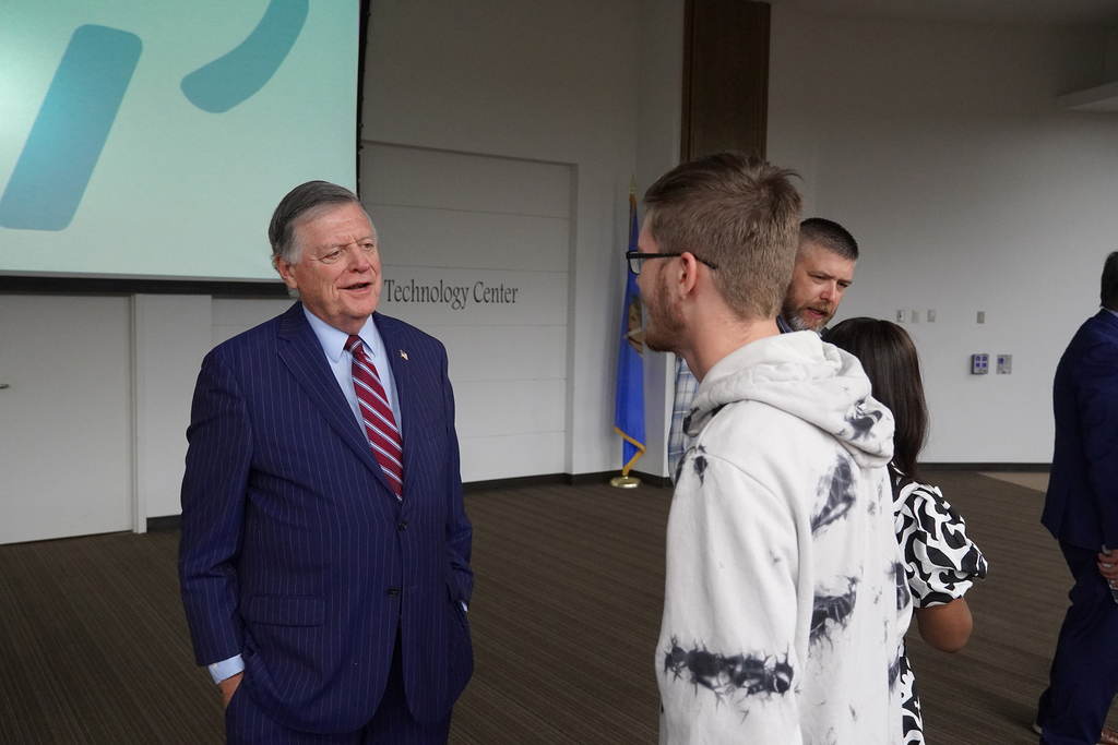 Two men talking to each other.