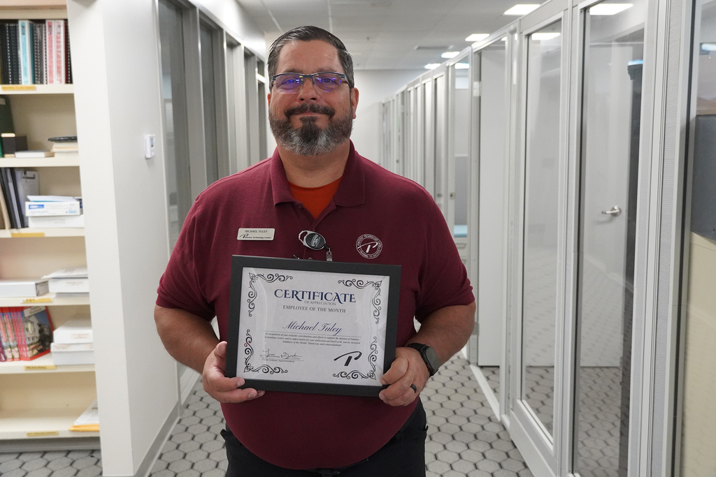 Man holding a certificate