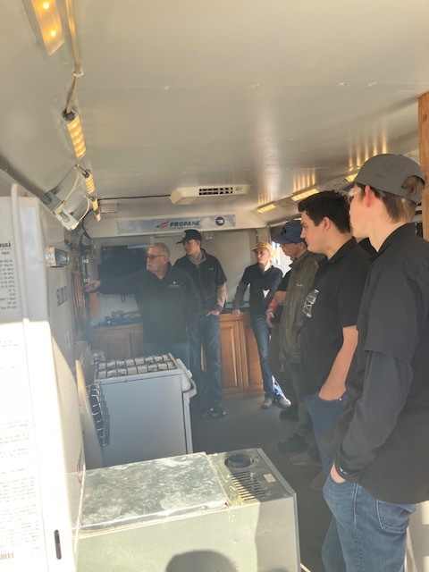 Students observing a demonstration by an expert.