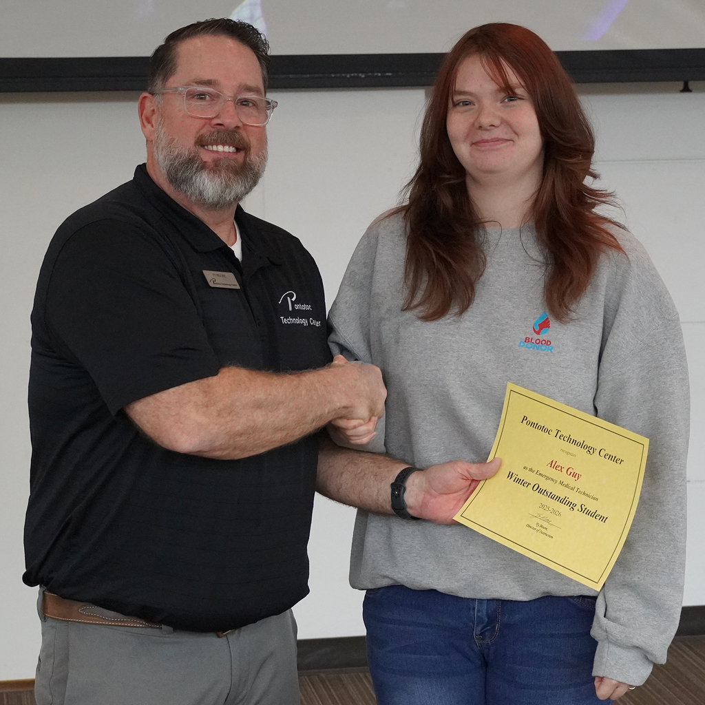 Two people posing with a certificate.
