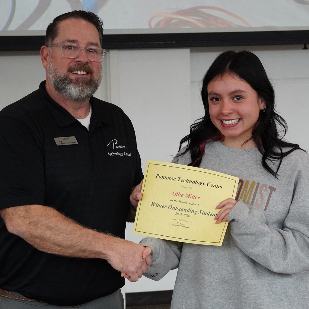 Two people posing with a certificate.