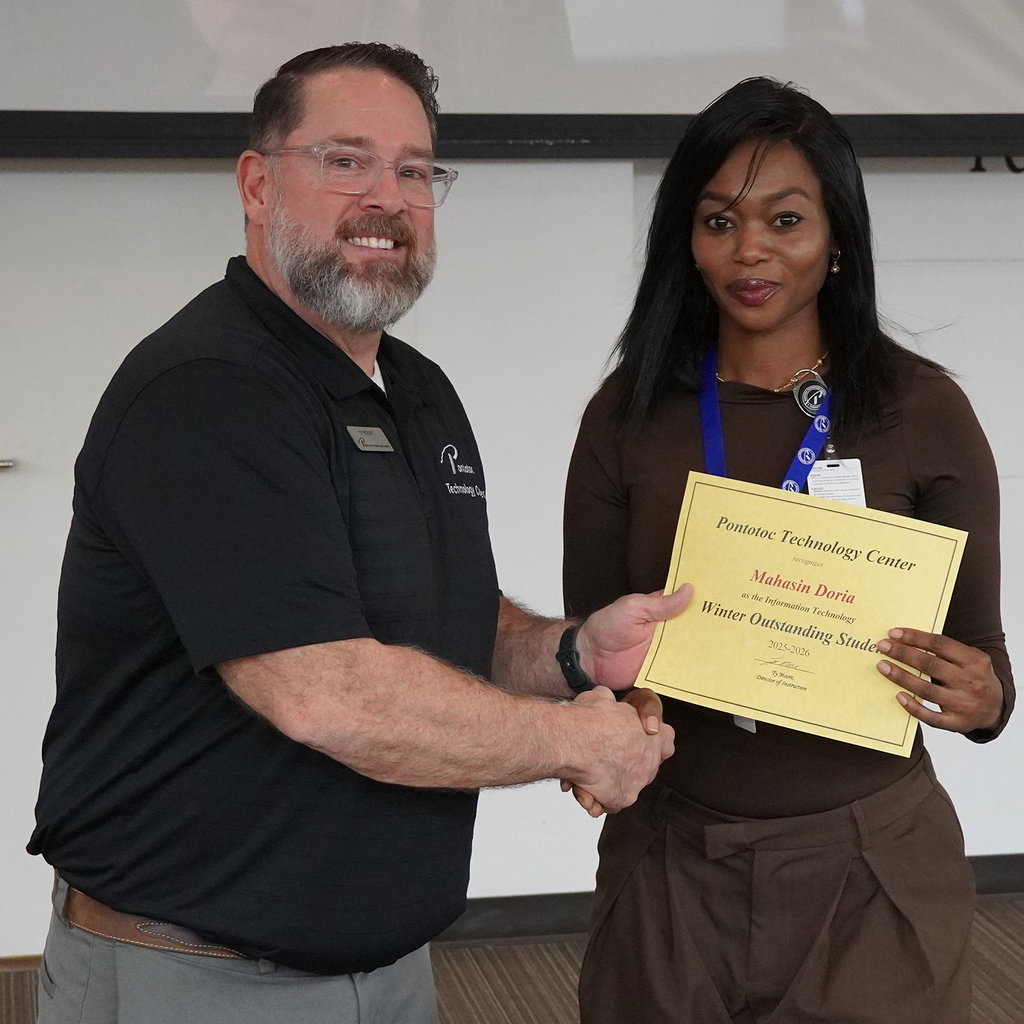 Two people posing with a certificate.