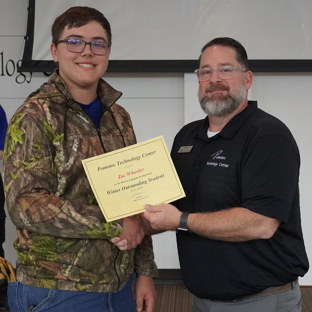 Two people posing with a certificate.