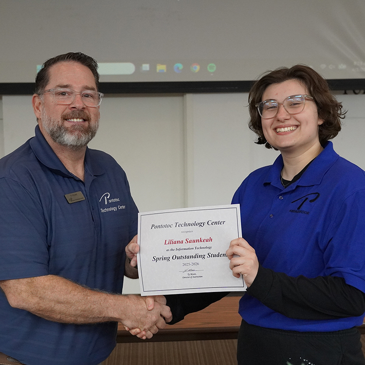 Two people posing with a certificate.
