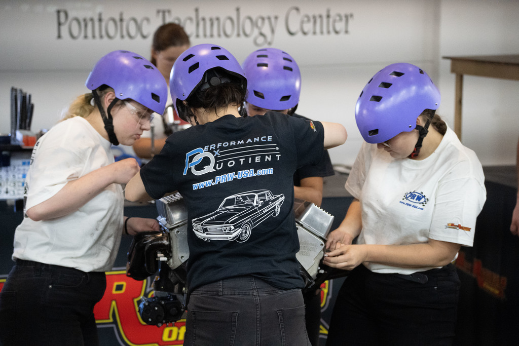 Students working on an engine