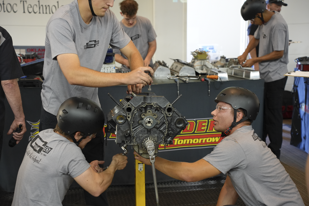 Students working on an engine