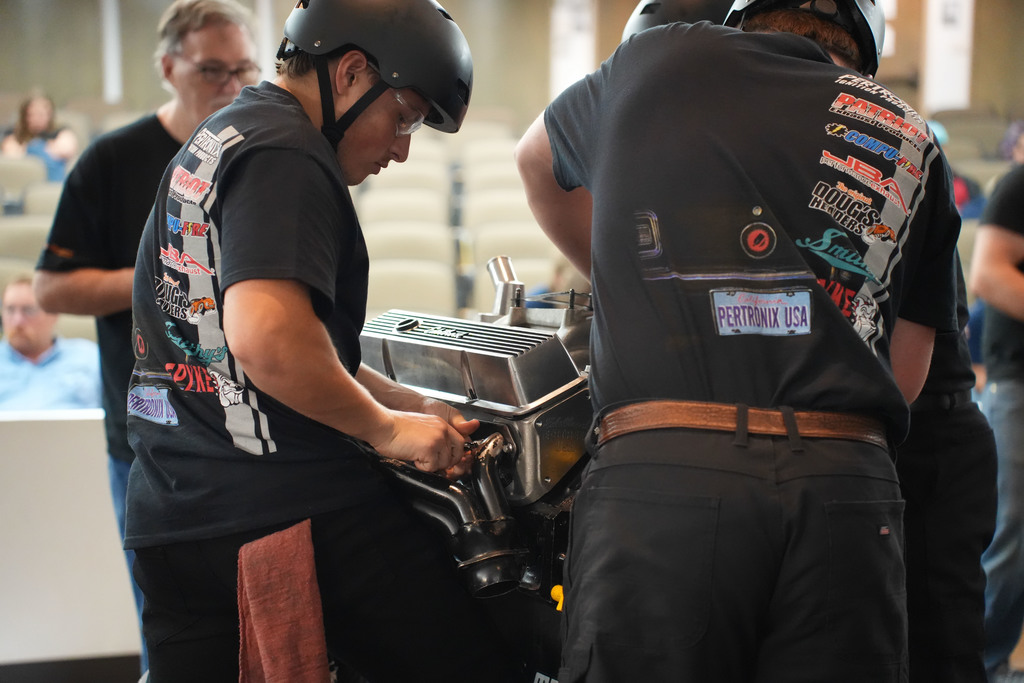 Students working on an engine