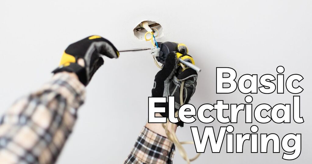 Gloved hands working on wiring a ceiling light