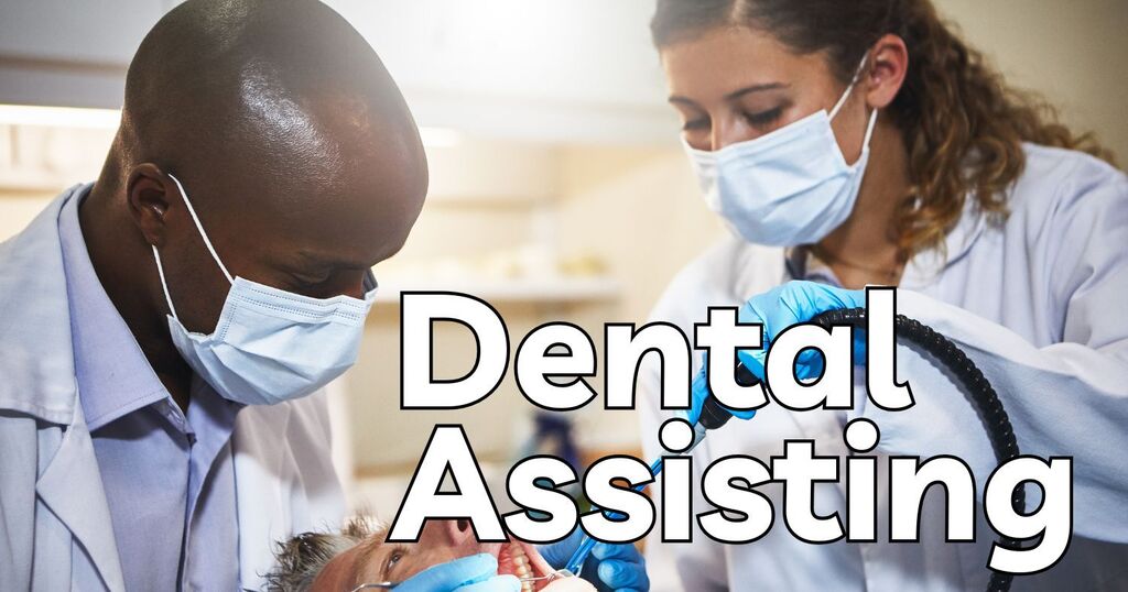 Dental assistants working with a patient.