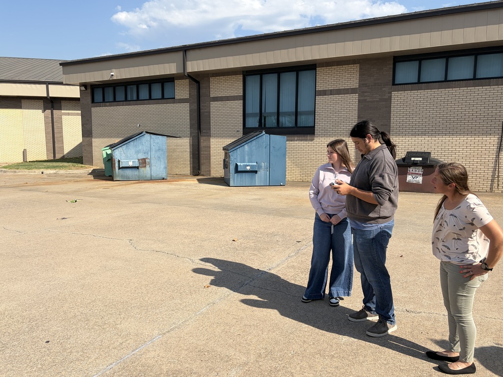 Students flying a drone outside