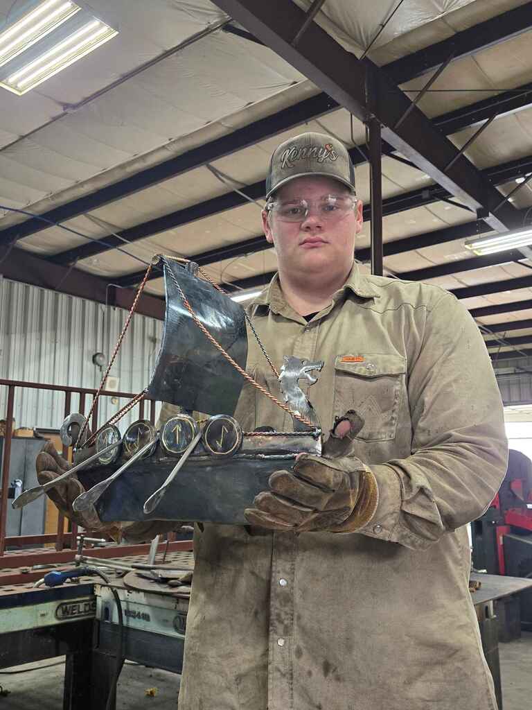 Person holding a model boat