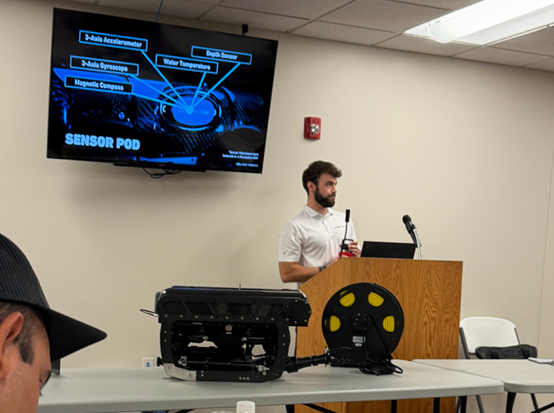 Person at a podium conducting a training