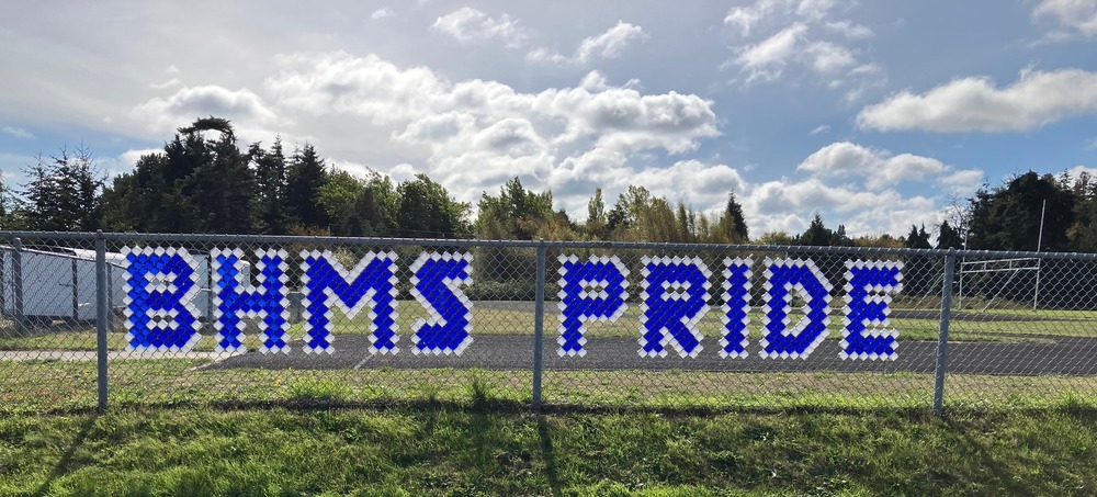 BHMS spelled out on the track fence