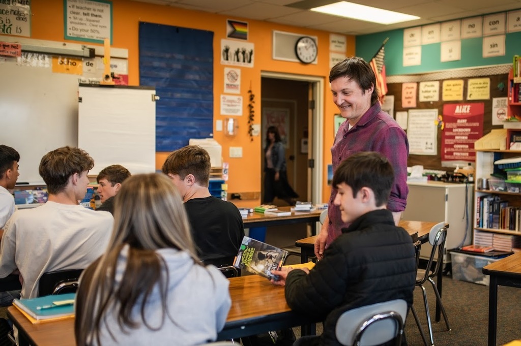 Students talk to their Spanish teacher at PTHS