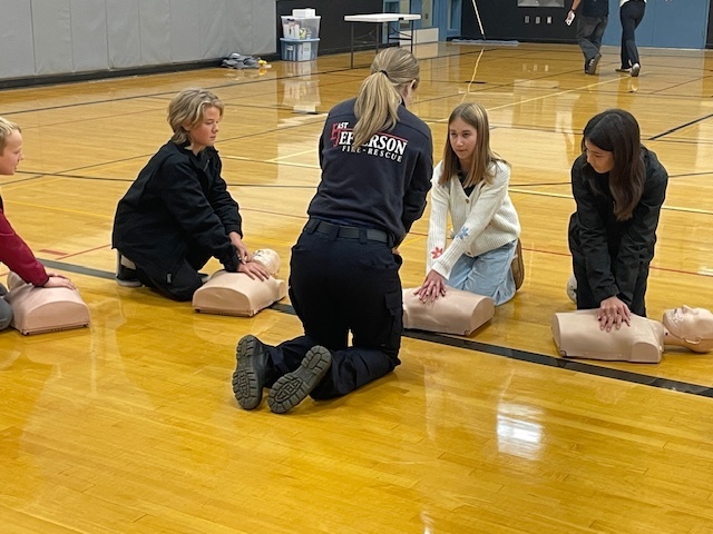 BH 8th grade students learning CPR at the Healthcare Career Fair