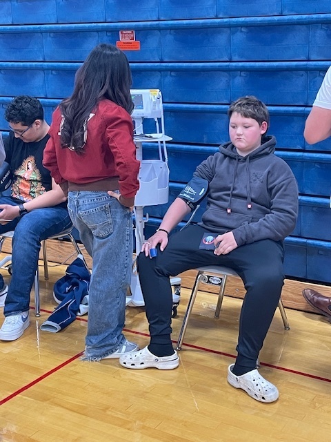 BH 8th grade students taking vitals  at the Healthcare Career Fair
