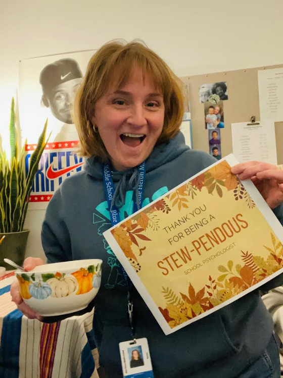 Photo of Blue Heron School Psychologist, Kristin Rubio, with Stew-pendous sign and stew bowl