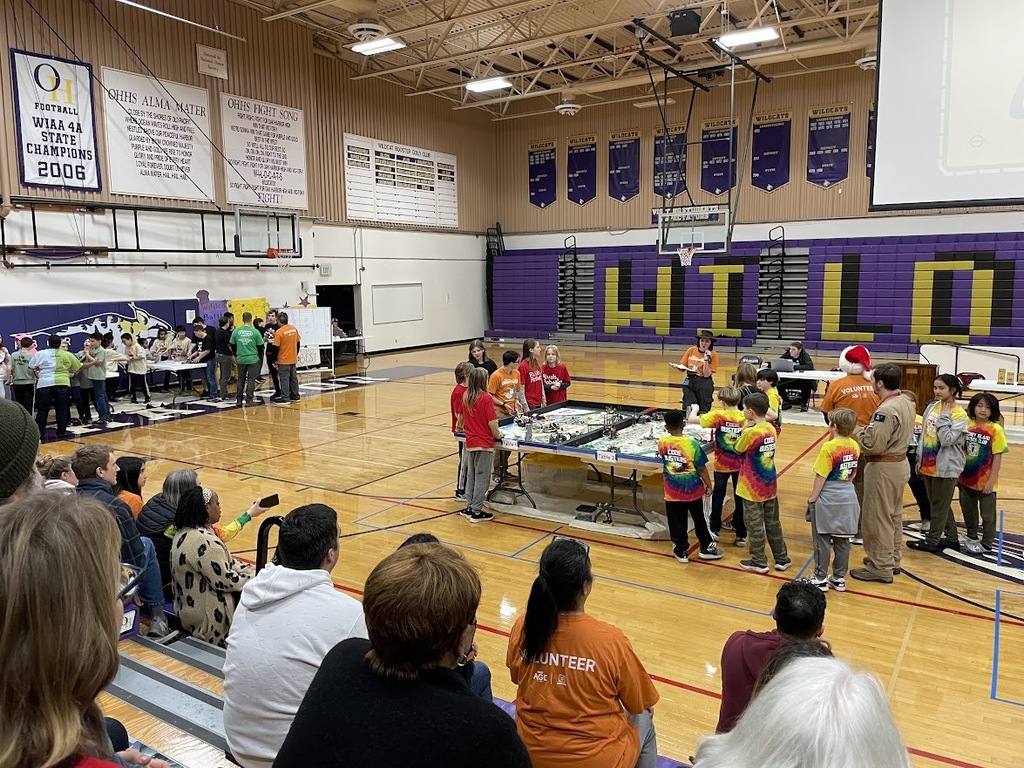 The Otter Bots, wearing their red Rivals Robotics shirts, competed in the First Lego League robotics competition and won the Rising All Stars Award