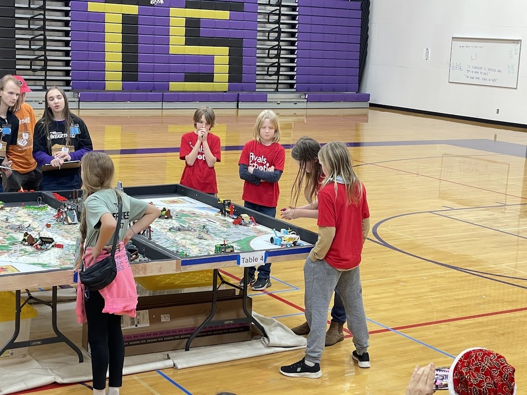 The Otter Bots, wearing their red Rivals Robotics shirts, competed in the First Lego League robotics competition and won the Rising All Stars Award