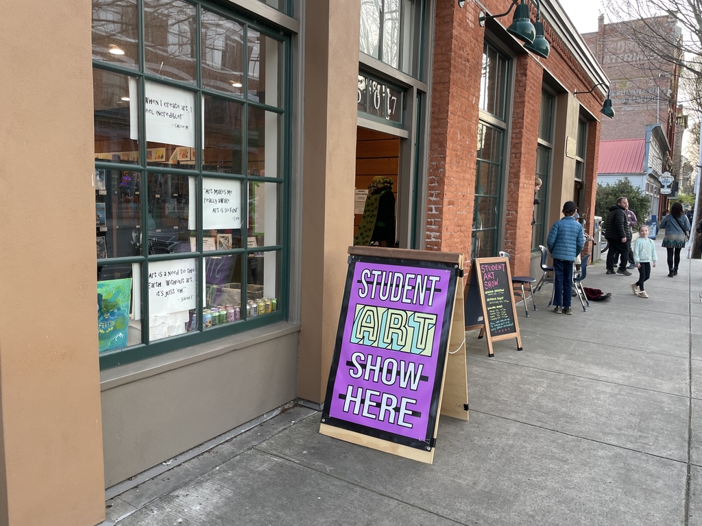 Student Art Show Here sign in front of Cotton Building