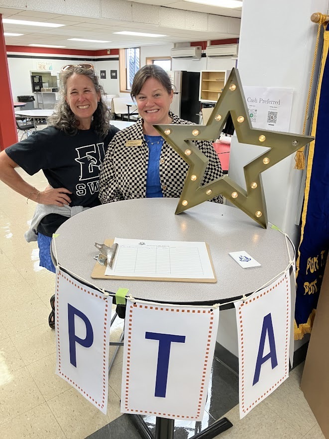Superintendent Linda and parent at PTA table event