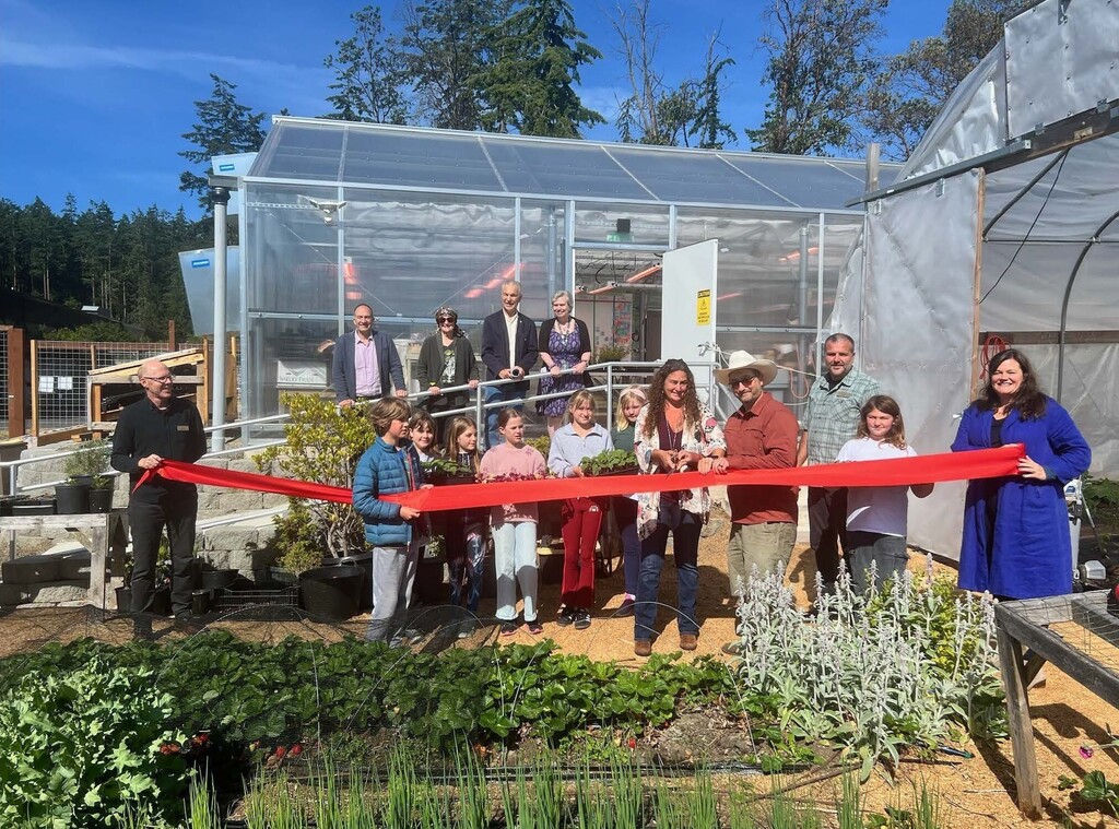 Greenhouse at Salish Coast ES with students and staff in the garden area 