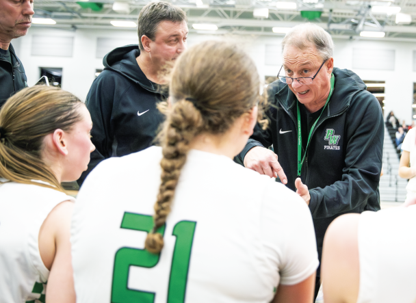 pwhs basketball coach dave ross explaining a play to his team