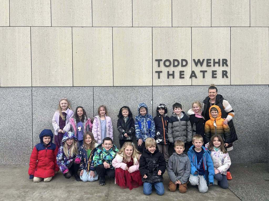 Class photo in front of theater