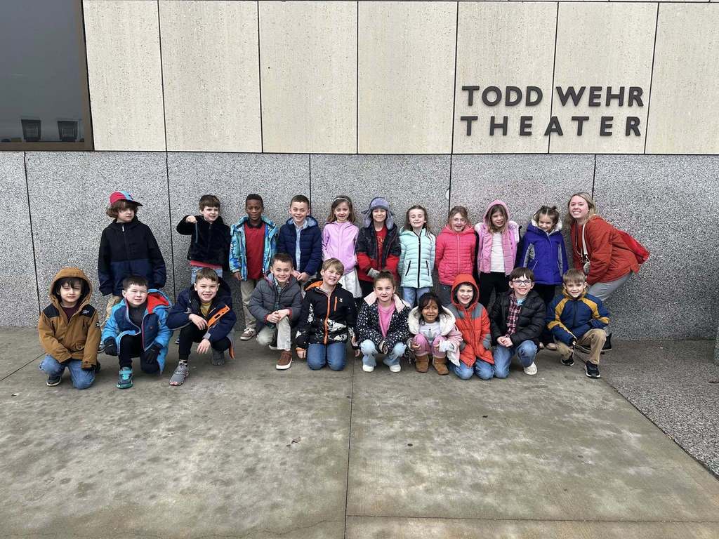 Class photo in front of theater