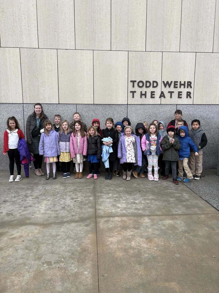 Class photo in front of theater