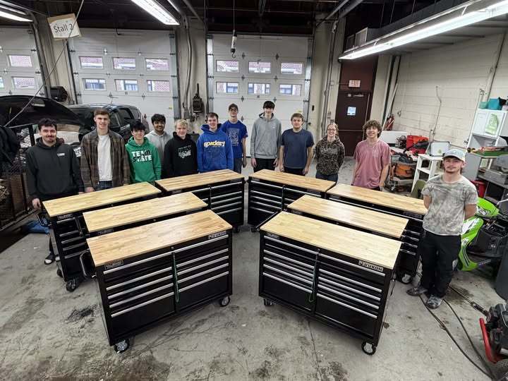 donated tool benches in front of a group of students
