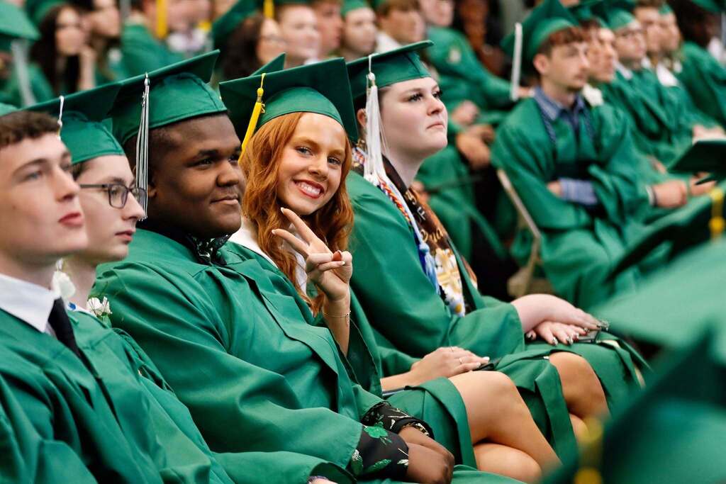 Student smiling in graduation attire