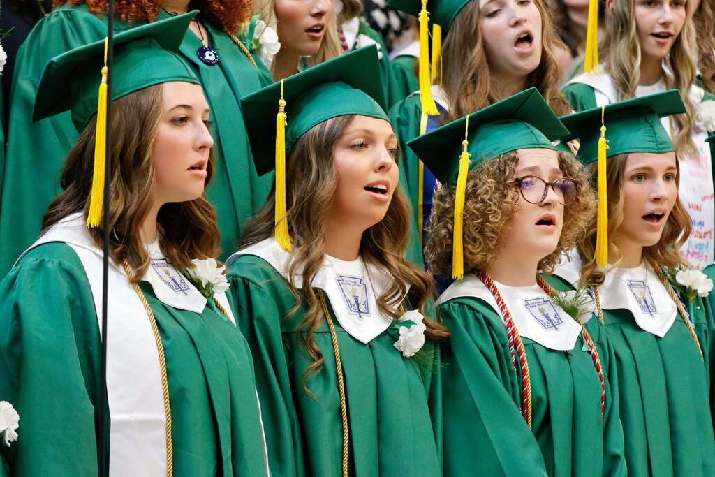 students singing at graduation in a choir