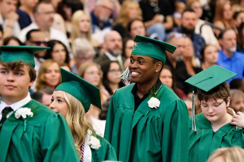 Student smiling in graduation attire