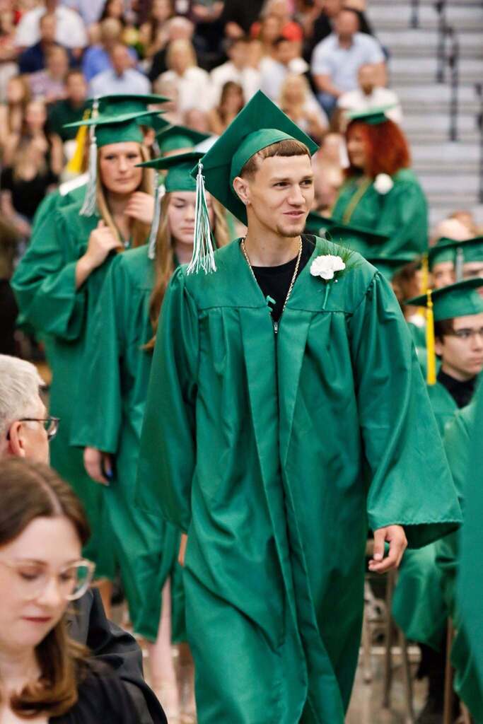 Student smiling in graduation attire