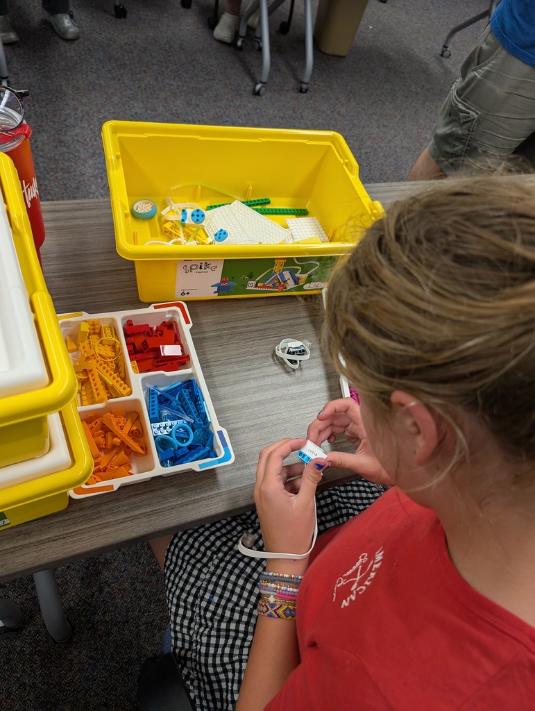 Student helper organizing a donated kit. 