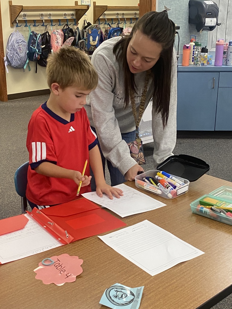 Teacher and student writing