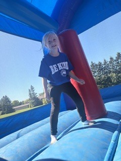 Student jumping at Kind Kids Day