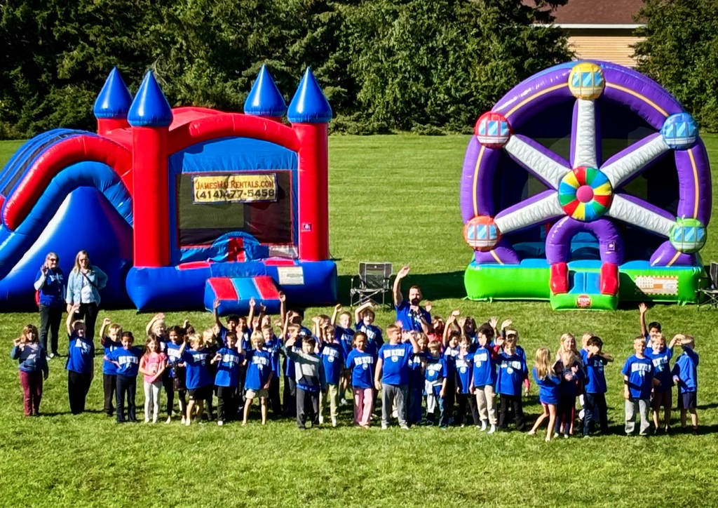 Students waving at Kind Kids Day