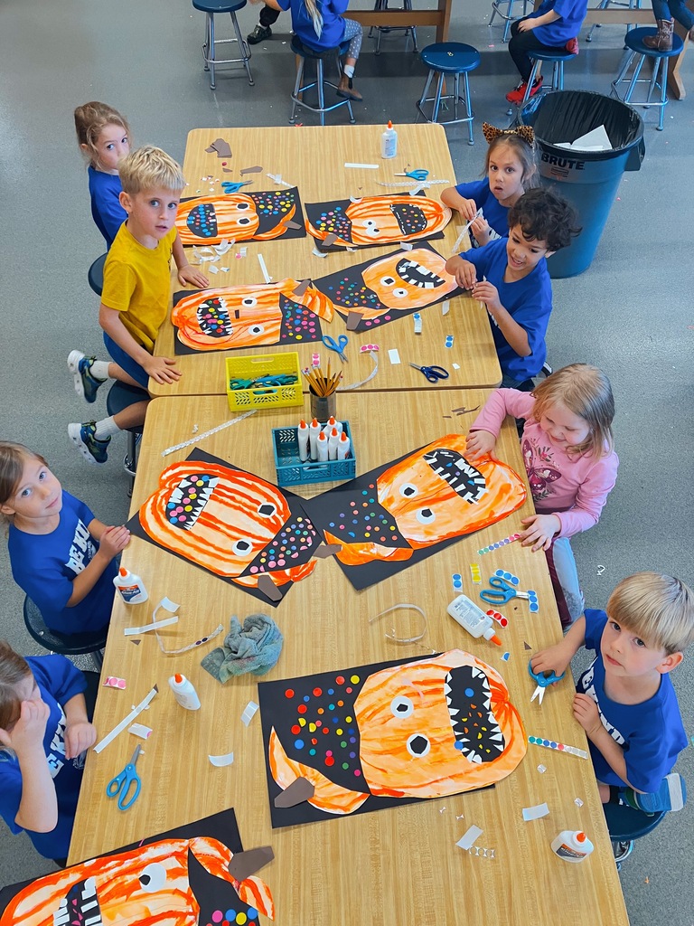 Students Creating Kindergarten Pumpkin Artwork
