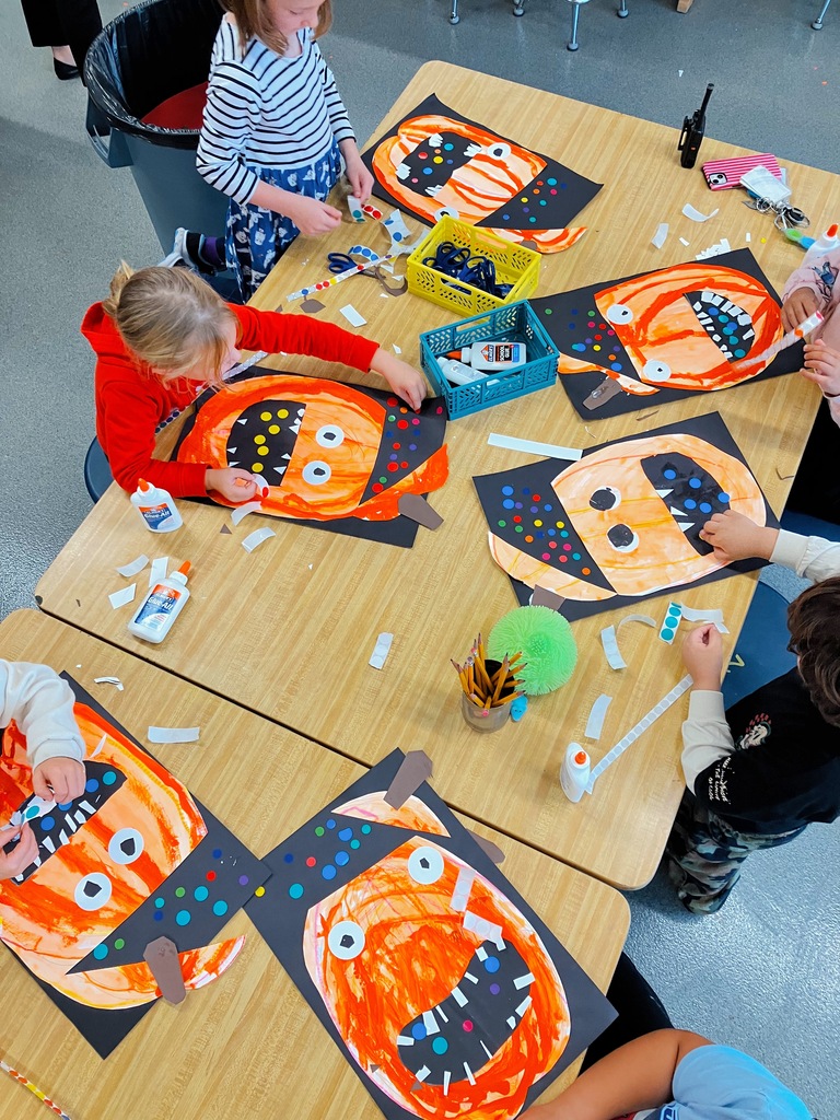 Students Creating Kindergarten Pumpkin Artwork