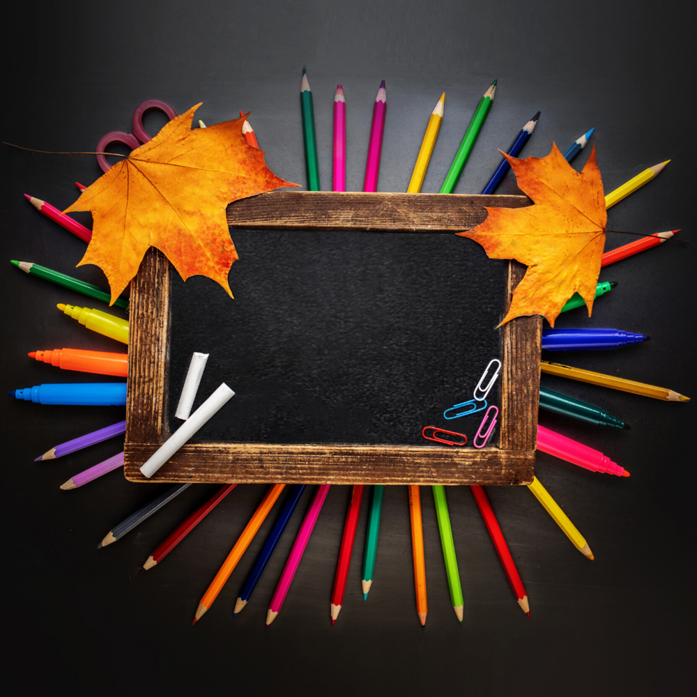 writing utensils, chalk board and fall leaves