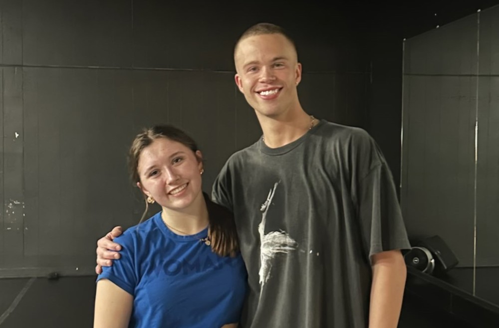 a man and girl pose for a photo together