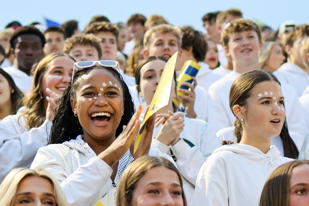 students cheering in a student section