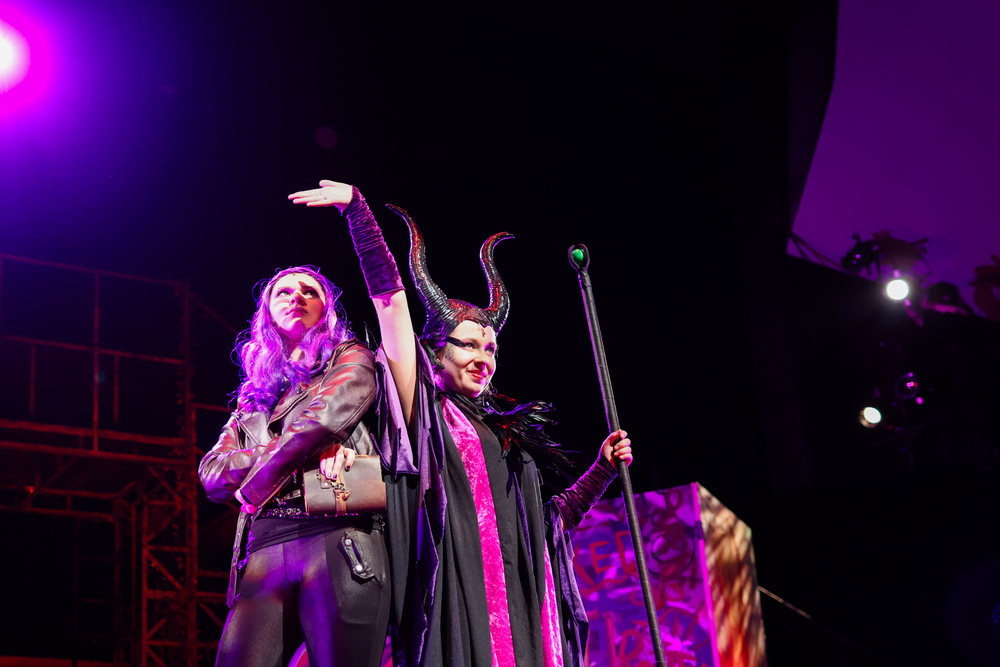 students in costume on stage