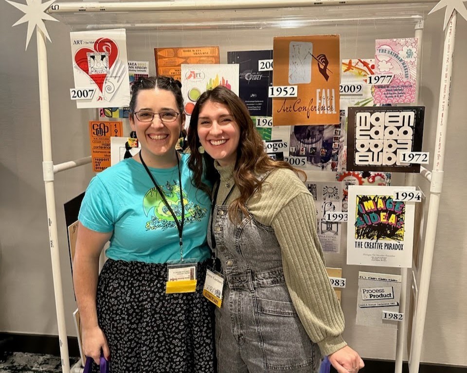 two women pose for a photo