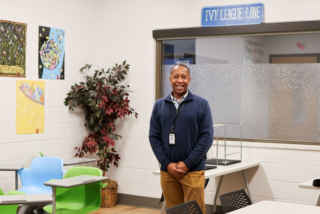 a man stands in a classroom