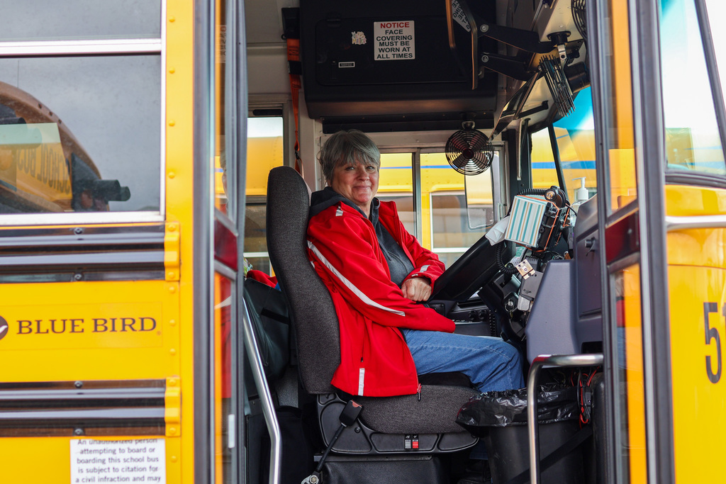 a bus driver sitting in her bus